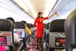 air asia complaints, air asia booking ticket low fares, air asia ordered to pay rs 1 54 lakh for harassing serving non veg food to passenger, Air asia